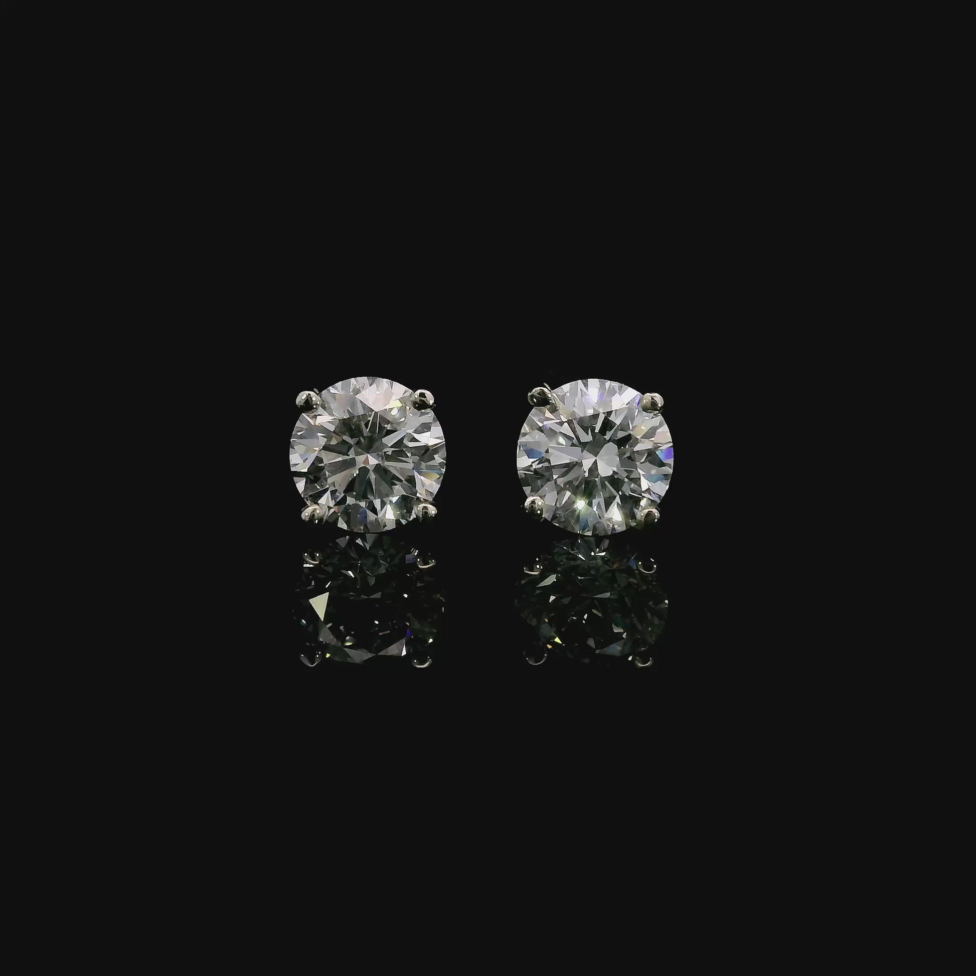 14K White gold studs set with round brilliant diamonds. Item J37952 - ABC Jewelry Co. 