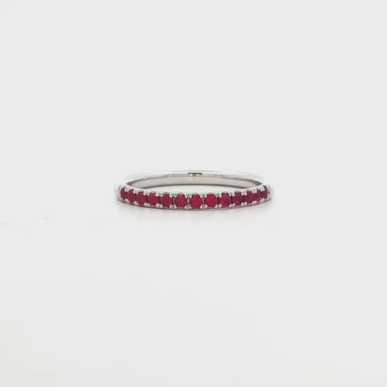 18K White gold band set with round brilliant rubies. Item J36902 - ABC Jewelry Co.