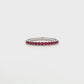 18K White gold band set with round brilliant rubies. Item J36902 - ABC Jewelry Co.
