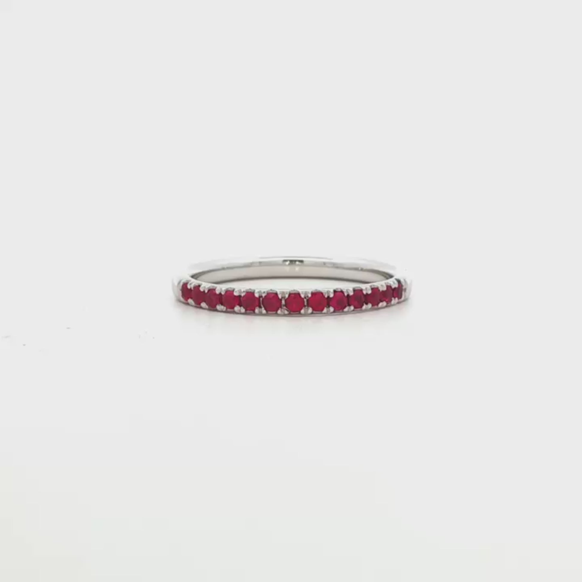 18K White gold band set with round brilliant rubies. Item J36902 - ABC Jewelry Co.
