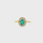 14K Yellow gold ring set with an oval shape opal center stone surrounded by a diamond halo. Item J38784 - ABC Jewelry Co. 