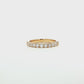 14K Yellow gold band set with round brilliant diamonds. Item J39113 - ABC Jewelry Co.