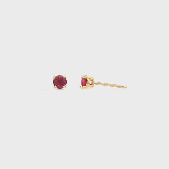 14K Yellow gold stud earring set with round cut rubies. Item 12441 - ABC Jewelry Co. 