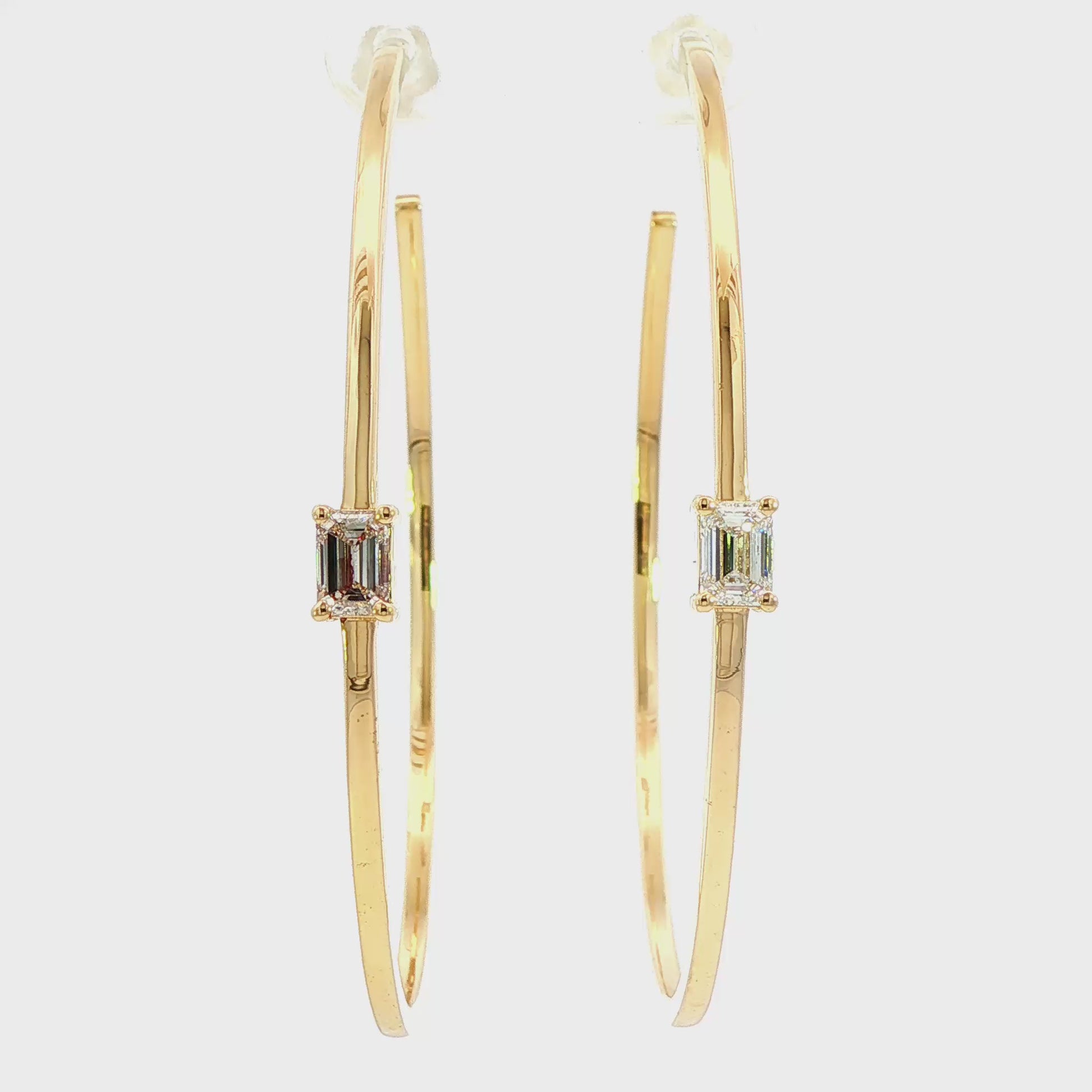 14K Yellow gold hoop earrings, each set with 1 emerald cut LAB GROWN diamond. Item J38829 - ABC Jewelry Co. 