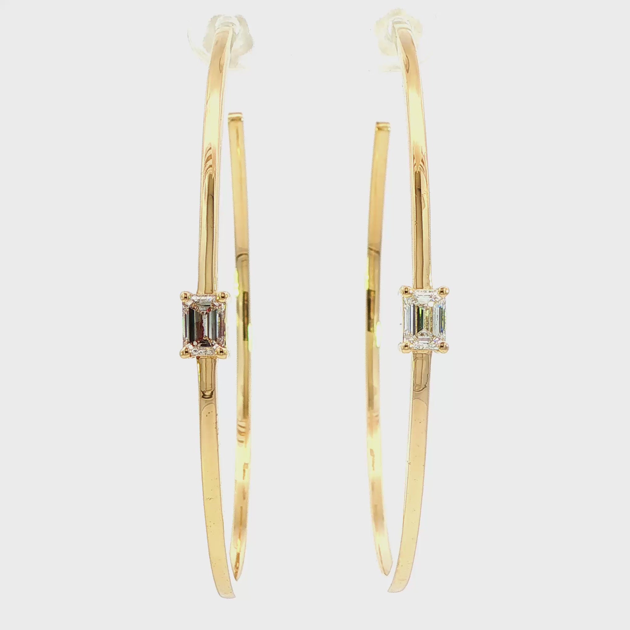 14K Yellow gold hoop earrings, each set with 1 emerald cut LAB GROWN diamond. Item J38829 - ABC Jewelry Co. 