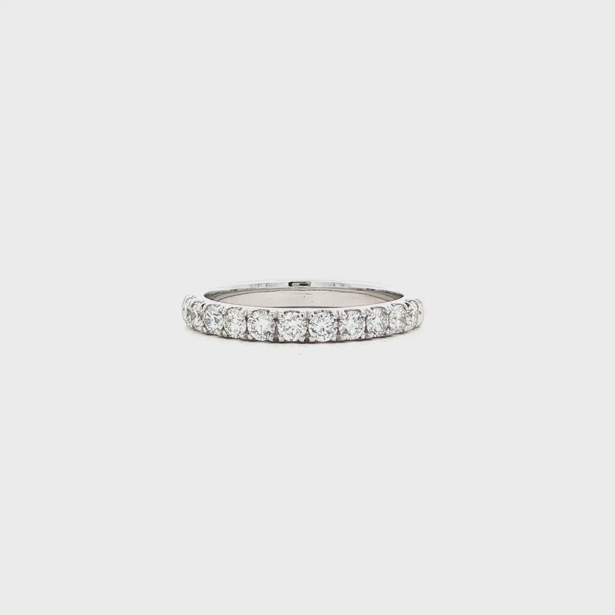 14K White gold band set with round brilliant diamonds. Item J39111 - ABC Jewelry Co. 