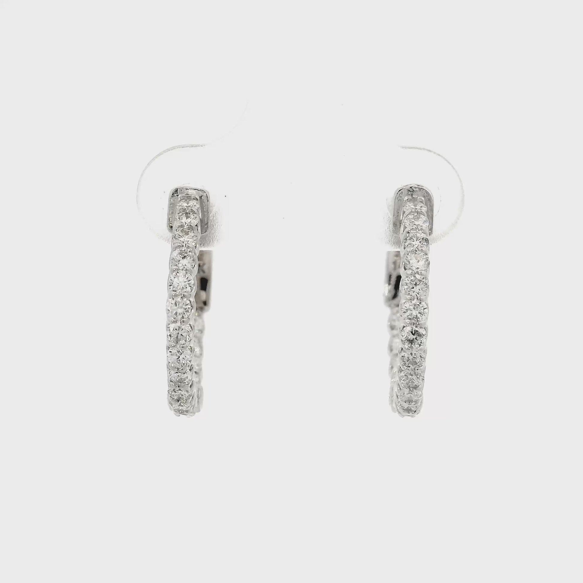 14K White gold hoop earrings set with round brilliant diamonds. Item J37819 - ABC Jewelry CO 