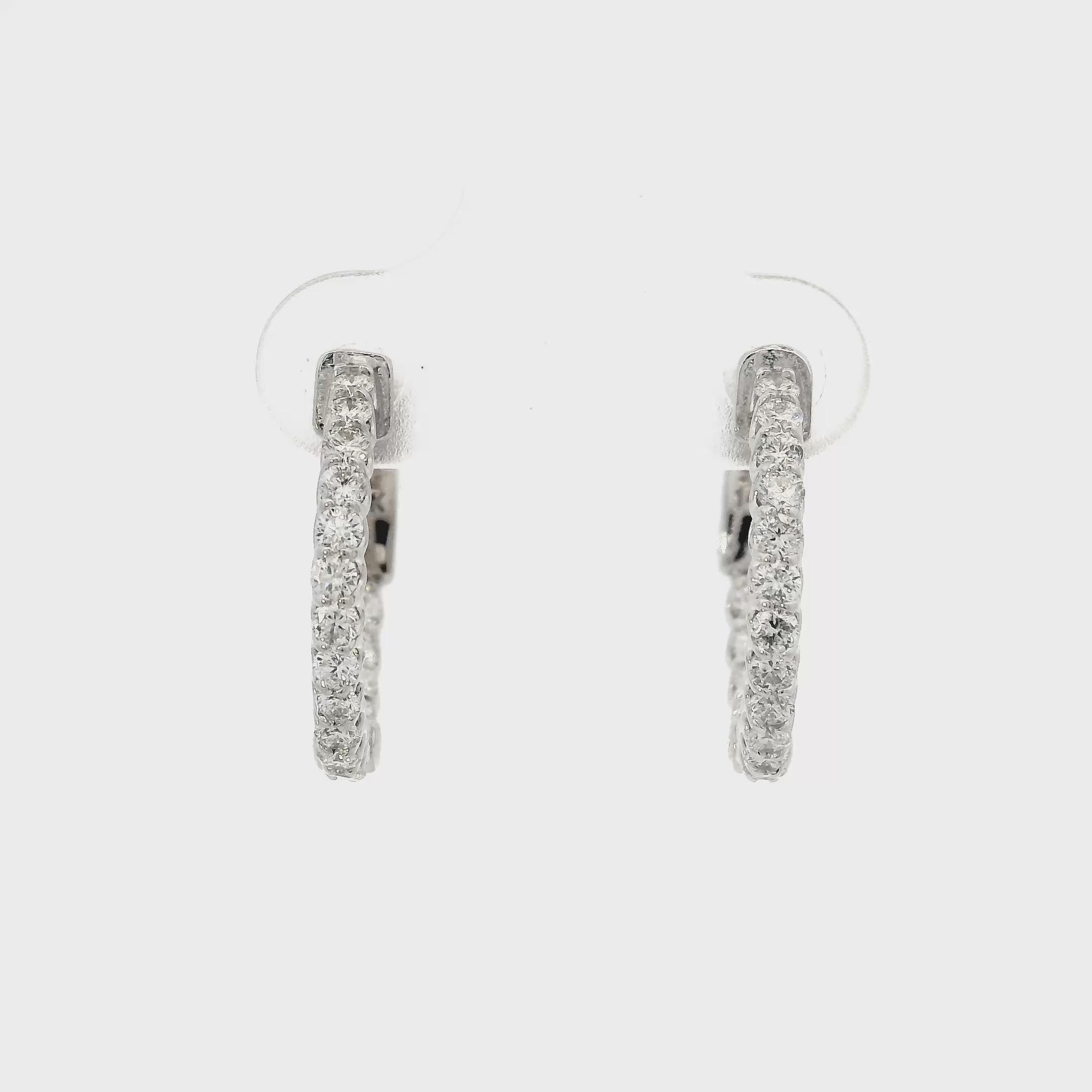 14K White gold hoop earrings set with round brilliant diamonds. Item J37819 - ABC Jewelry CO 
