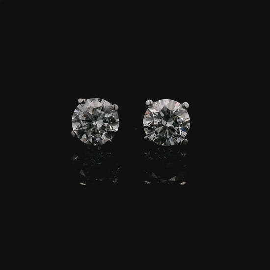 14K White gold stud earrings set with round brilliant diamonds. Item J37751 - ABC Jewelry Co.