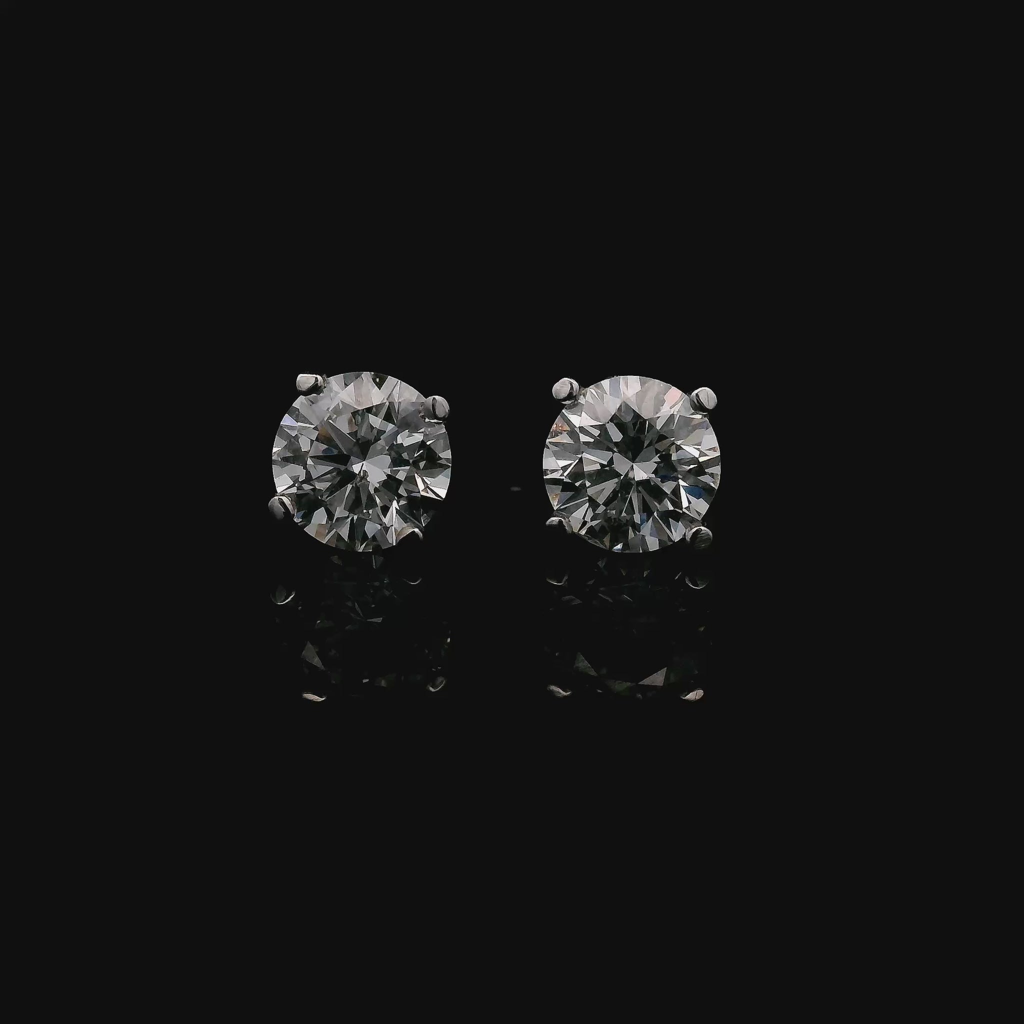 14K White gold stud earrings set with round brilliant diamonds. Item J37751 - ABC Jewelry Co.